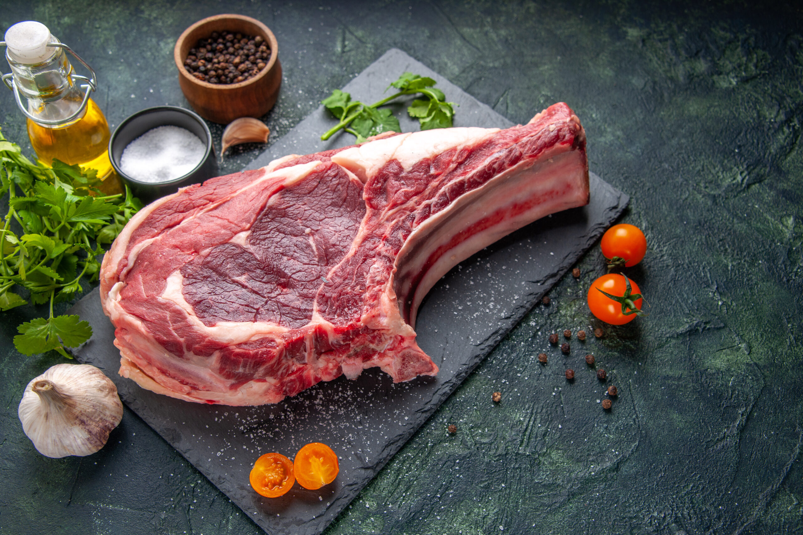 front-view-big-meat-slice-raw-meat-with-pepper-greens-dark-photo-chicken-meal-animal-barbecue-food-butcher